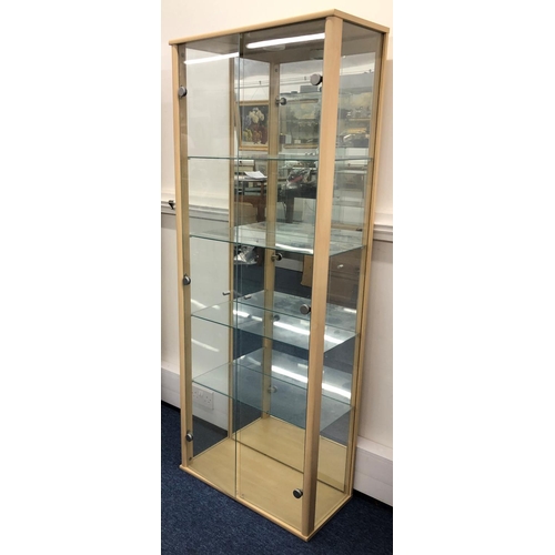 8122 - A modern display cabinet, 168cm high, 64.5cm wide, 32.5cm deep, with 2 glass doors enclosing interio... 