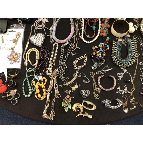 8066 - A large quantity of various costume jewellery, necklaces, bracelets, earrings, cufflinks etc.