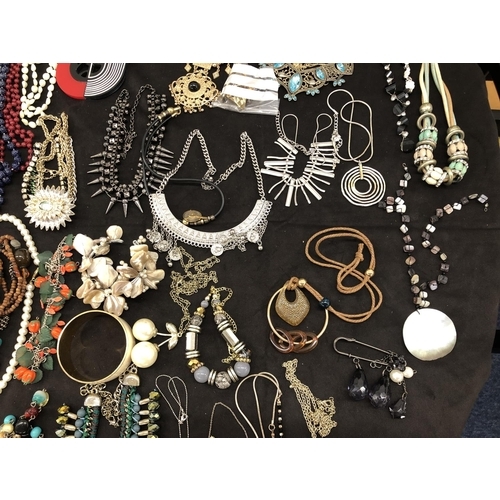 8066 - A large quantity of various costume jewellery, necklaces, bracelets, earrings, cufflinks etc.