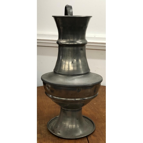 8277 - A large pewter vase, 62cm high (various dents to sides).