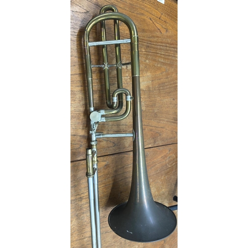 8278 - A brass trombone, (missing valves and mouthpiece), marked LP 350938 and etched ILEA to side, 119cm l... 