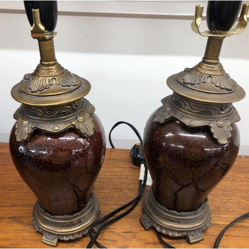 8286 - A pair of modern brown glazed lamps with ornate bronze style detail, 28cm high excluding bulb fittin... 