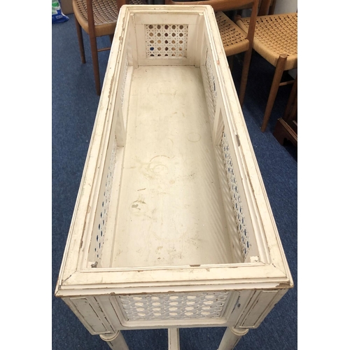 8291 - A white painted plant stand, 91cm wide, 31cm deep, 77cm high.