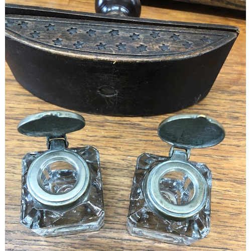 8295 - An oak inkwell stand with 2 glass ink bottles and a carved wood blotter.