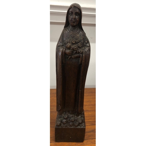 8298 - A wood carved figure 30cm high inscribed A.de Taeys.