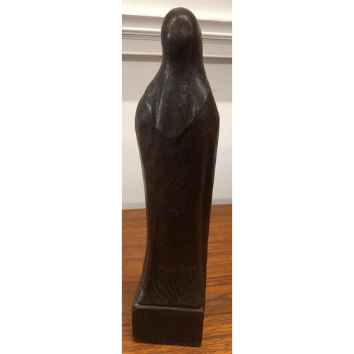 8298 - A wood carved figure 30cm high inscribed A.de Taeys.