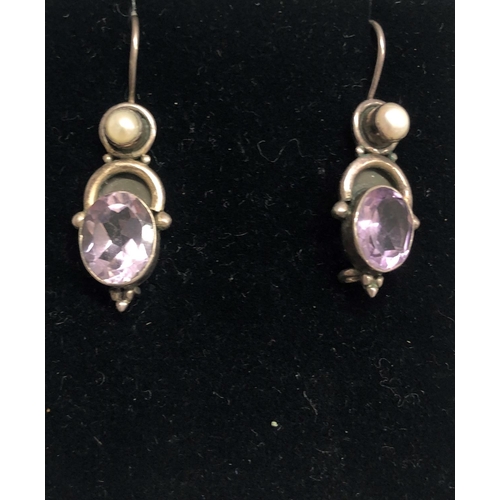 8305 - A pair of silver coloured metal pendant earrings with purple stone and half pearls, 3.6cm long overa... 