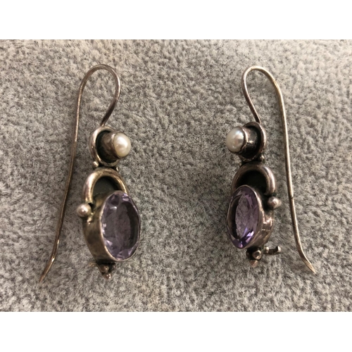 8305 - A pair of silver coloured metal pendant earrings with purple stone and half pearls, 3.6cm long overa... 