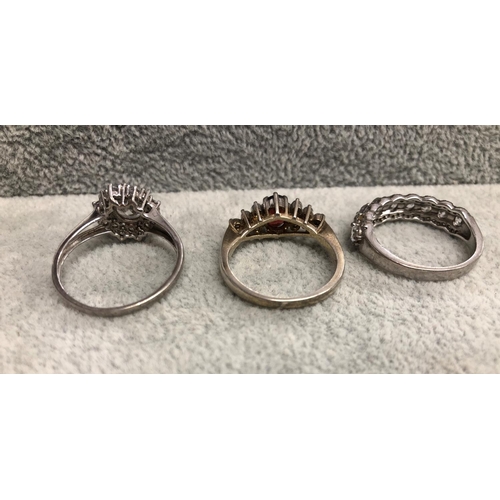 8309 - 3 silver coloured metal dress rings.