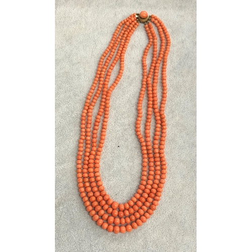 8311 - A 4 string coral necklace, 44cm long overall.