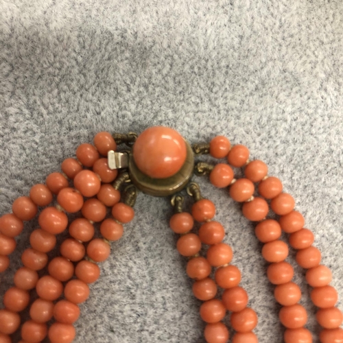 8311 - A 4 string coral necklace, 44cm long overall.