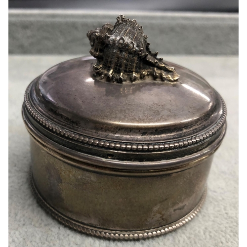 8312 - A 925 silver round box with shell to lid, 6cm diameter.