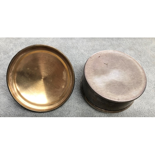 8312 - A 925 silver round box with shell to lid, 6cm diameter.