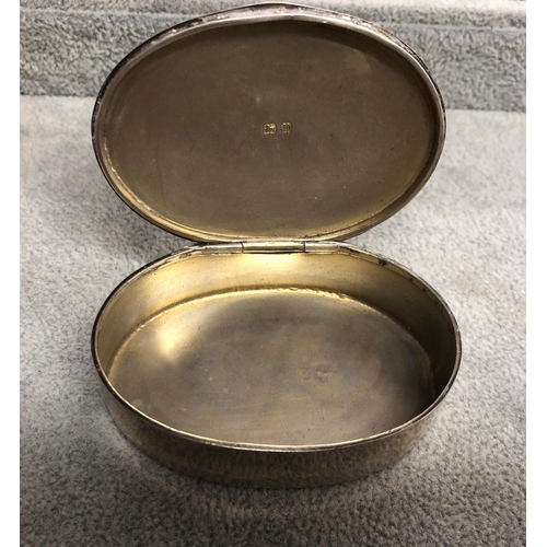 8313 - An oval silver box with engine turn decoration and inscribed to top, 6.5cm wide ( dent to 1edge of b... 