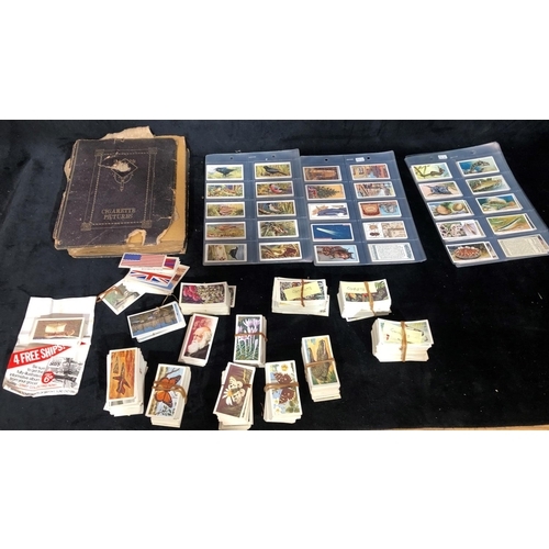 8275 - A leather bound Cigarette card album (album in poor condition) containing Will's First Aid, Overseas... 