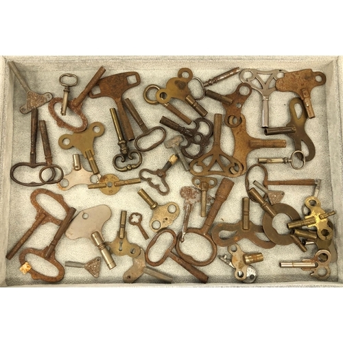 8292 - A quantity of various watch and clock keys.