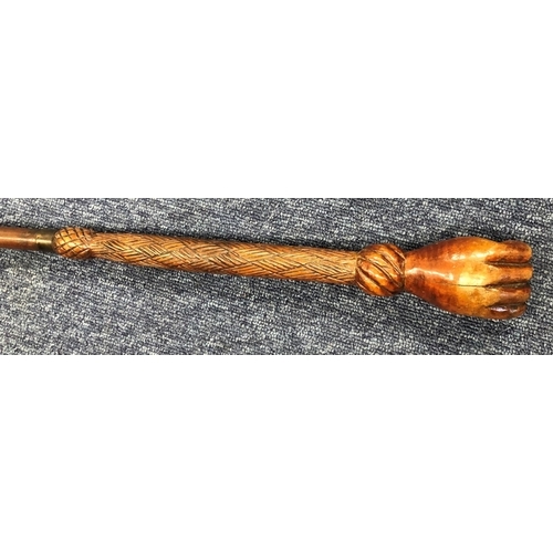 8301 - 20th Century carved wood cane with clenched fist handle, 83.5cm long (wood split to back of hand).