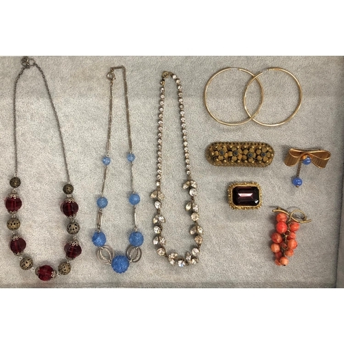 8310 - 3 necklaces, a pair of gold coloured hoop earrings and 4 various brooches.