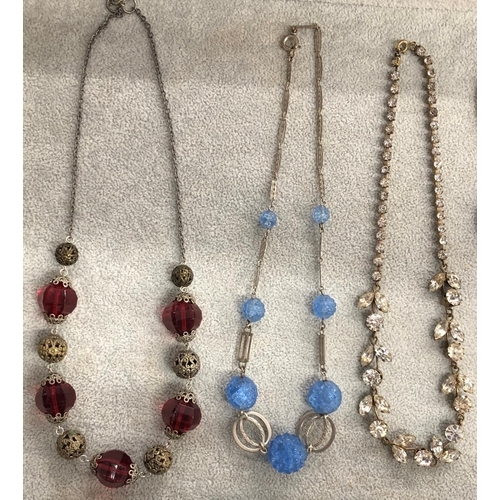 8310 - 3 necklaces, a pair of gold coloured hoop earrings and 4 various brooches.