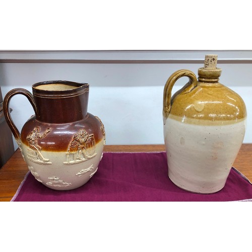 8330 - A Doulton Lambeth earthenware jug, 22cm high (chipped to rim) and a stoneware storage jar impressed ... 