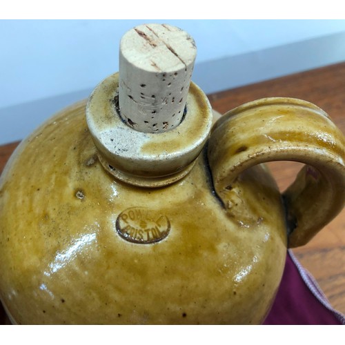 8330 - A Doulton Lambeth earthenware jug, 22cm high (chipped to rim) and a stoneware storage jar impressed ... 