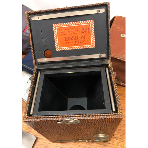 8329 - An Eastman Kodak Company camera with brown leather case, an Ensign box camera with canvas case, a Ca... 