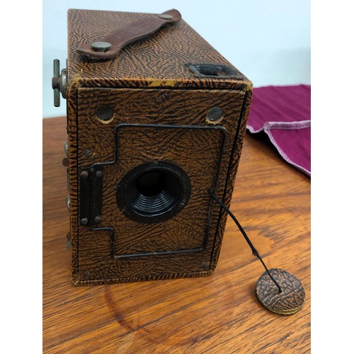 8329 - An Eastman Kodak Company camera with brown leather case, an Ensign box camera with canvas case, a Ca... 