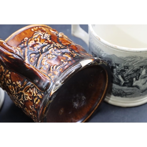 106 - A china frog mug on brown ground with raised figure, grape and vine decoration (chip to rim), 10.5cm... 