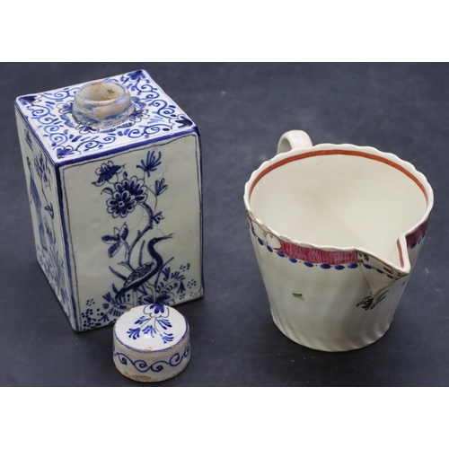 108 - A 19th Century Delft square tea caddy with cover and figure, bird and floral decoration, 11cm high a... 