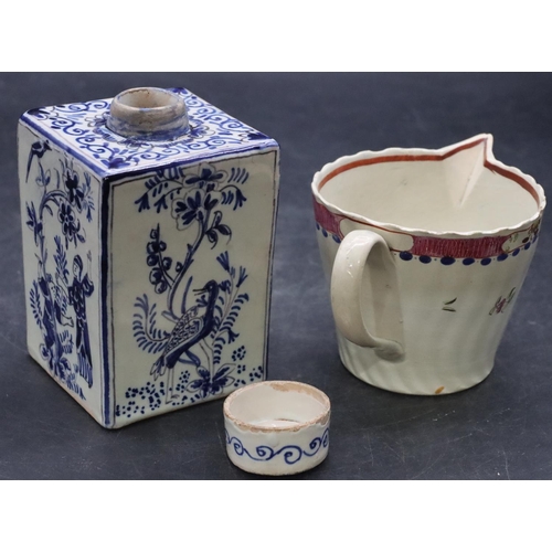 108 - A 19th Century Delft square tea caddy with cover and figure, bird and floral decoration, 11cm high a... 