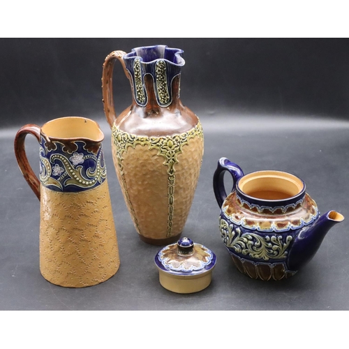 116 - A Doulton & Lambeth stoneware round bulbous shaped jug with crinkle top and scroll handle, on brown,... 