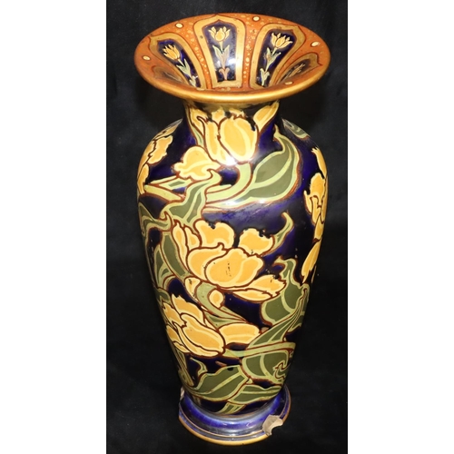 12 - A Doulton & Burslem round bulbous thin necked trumped shaped vase on blue ground with yellow and gre... 