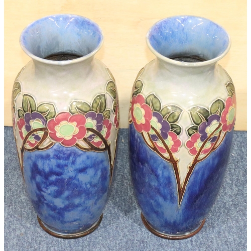 121 - A large pair of Royal Doulton glazed earthenware round bulbous thin necked trumpet shaped vases on b... 