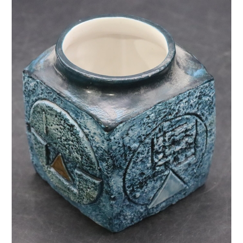 128 - A Troika cube vase on blue ground with raised circle and various shapes decoration, 9.5cm high