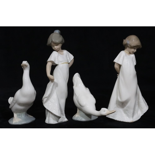 137 - 2 Nao figures of young standing girls in white dresses, 22cm high and a pair of Nao figures of geese... 