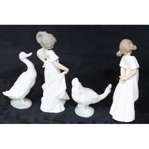 137 - 2 Nao figures of young standing girls in white dresses, 22cm high and a pair of Nao figures of geese... 