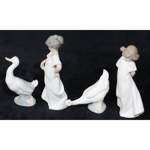 137 - 2 Nao figures of young standing girls in white dresses, 22cm high and a pair of Nao figures of geese... 