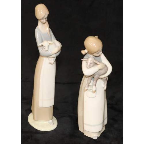 148 - 2 Lladro figurines of a young standing girl holding a lamb, 22cm high and a standing lady holding a ... 