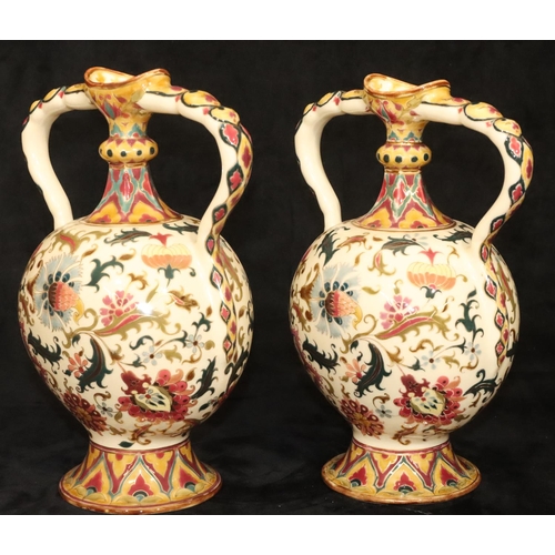 152 - A pair of Continental oval bulbous thin necked 2-handled vases on cream ground with multi-coloured f... 