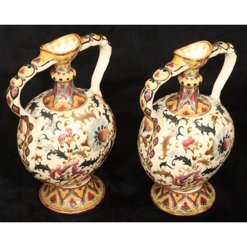 152 - A pair of Continental oval bulbous thin necked 2-handled vases on cream ground with multi-coloured f... 