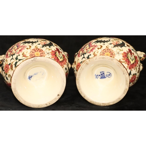 152 - A pair of Continental oval bulbous thin necked 2-handled vases on cream ground with multi-coloured f... 