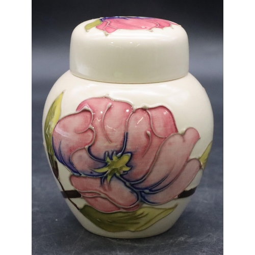 157 - A modern Moorcroft round bulbous lidded ginger jar on cream ground with multi-coloured floral and le... 