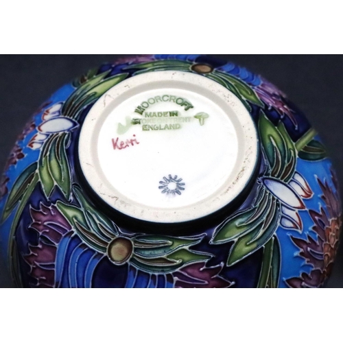 160 - A modern Moorcroft round bulbous lidded pot on turquoise and green ground with multi-coloured floral... 