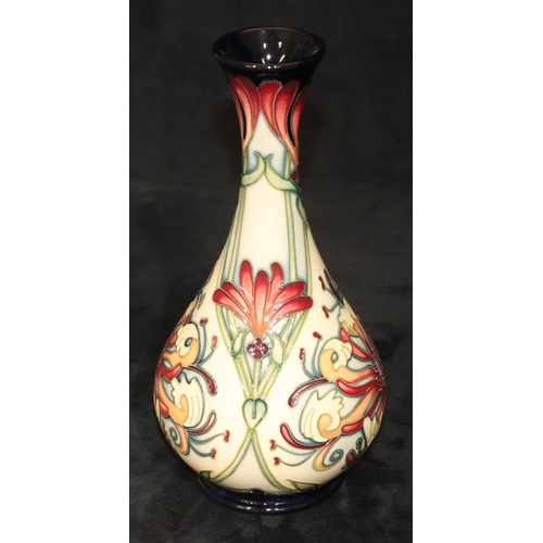 162 - A modern Moorcroft round bulbous thin necked trumpet shaped vase on cream and blue ground with multi... 