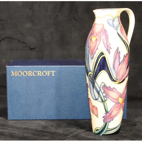 164 - A modern Moorcroft tall cylindrical jug on cream ground with multi-coloured floral and leaf decorati... 