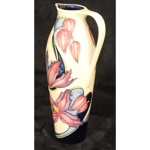 164 - A modern Moorcroft tall cylindrical jug on cream ground with multi-coloured floral and leaf decorati... 