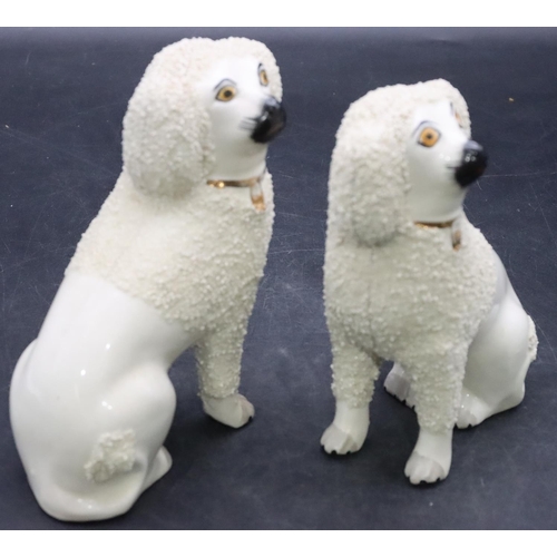 168 - A pair of 19th Century Staffordshire figures of seated spaniels on white ground with encrusted decor... 