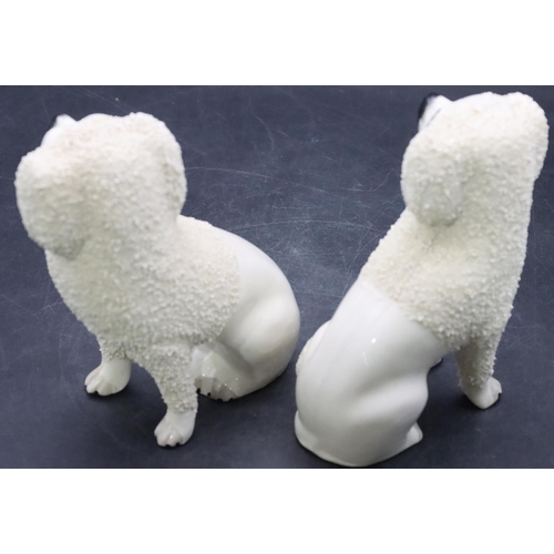 168 - A pair of 19th Century Staffordshire figures of seated spaniels on white ground with encrusted decor... 