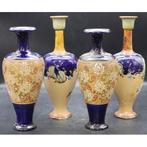 176 - A pair of Royal Doulton glazed earthenware round bulbous thin necked trumpet shaped vases on blue gr... 