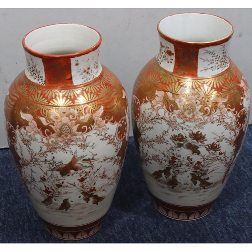 180 - A pair of Oriental round bulbous thin necked vases on white and red ground with coloured bird, lands... 